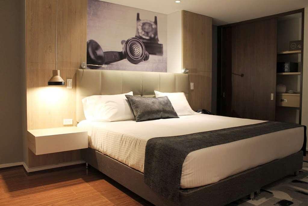 Quo Quality Hotel Manizales Ruang foto A bedroom at the hotel