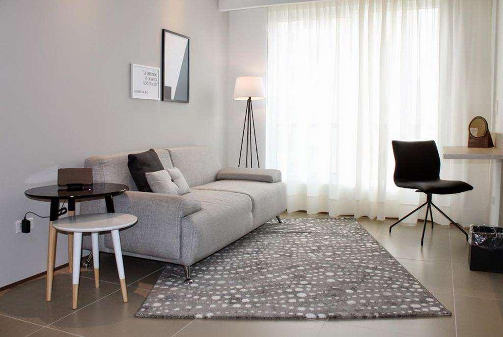 Quo Quality Hotel Manizales Ruang foto A living room with a rug
